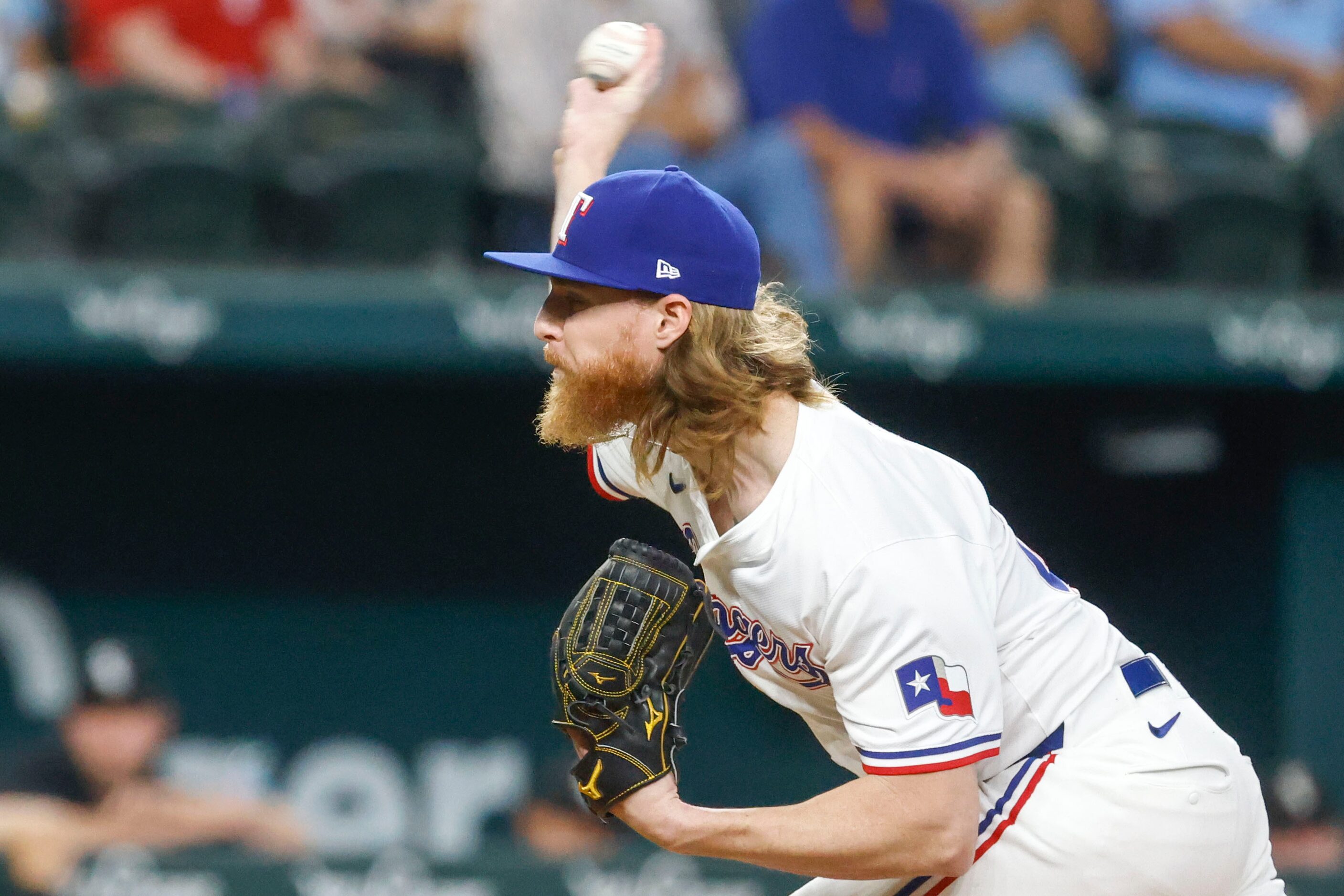 Texas Rangers starting pitcher Jon Gray throws during the first inning of a baseball game...