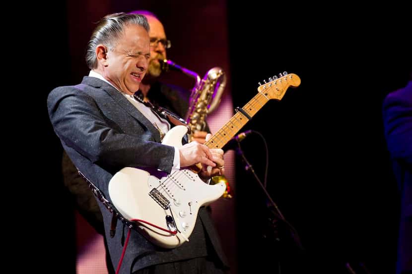 
In this 2013 file photo, Jimmie Vaughan performs at Eric Clapton's Crossroads Guitar...