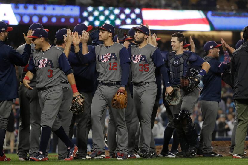 United States celebrates after defeating Japan, 2-1, in a semifinal in the World Baseball...