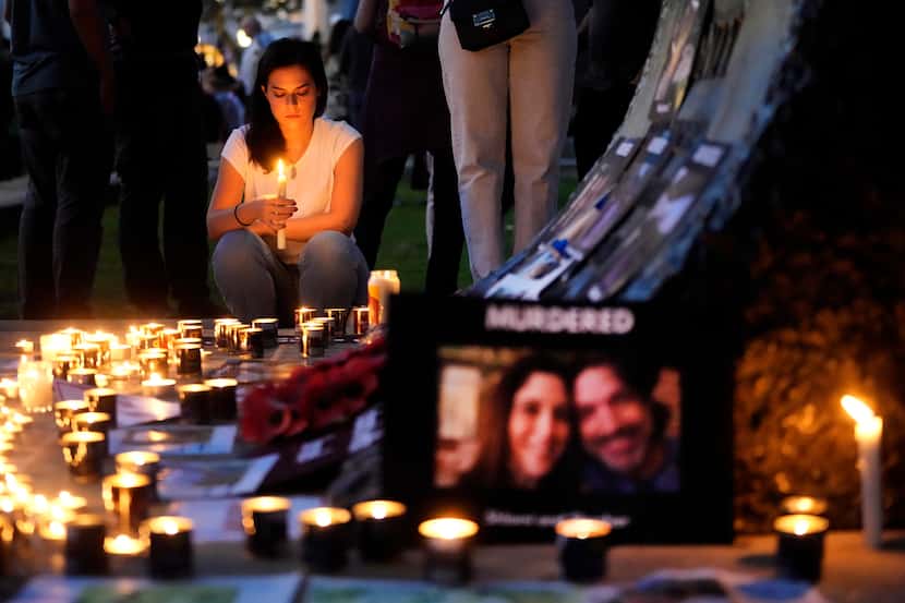 People light candles during the 'Jewish Community Vigil' for Israel in London, Monday, Oct....