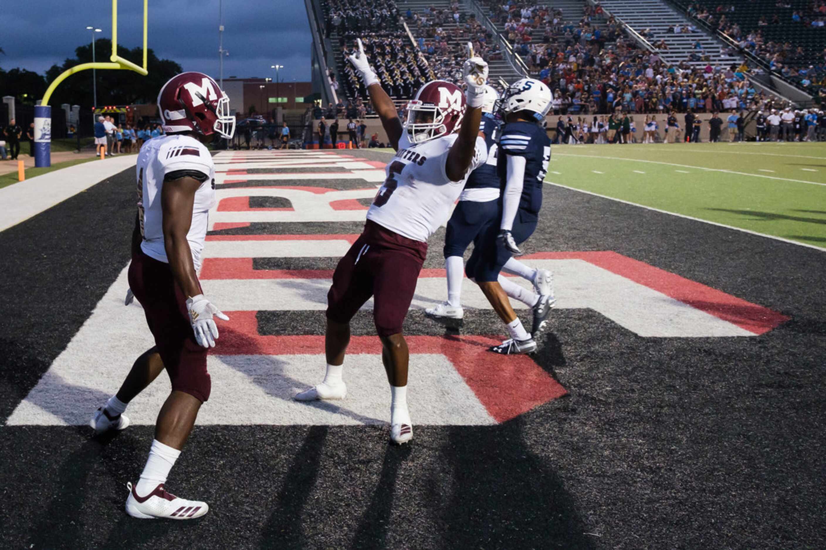 Mesquite running back LaDarius Turner (4) celebrates with wide receiver K.B. Frazier (5)...