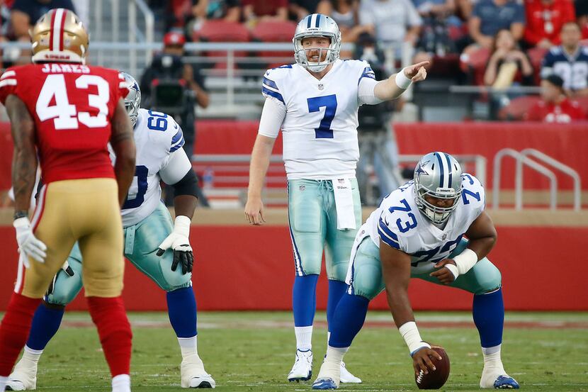 Dallas Cowboys quarterback Cooper Rush (7) yells behind center Joe Looney (73) during the...