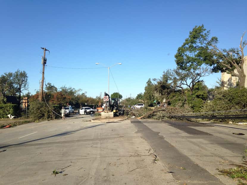 Looking west down Royal Lane near Preston Road, where power lines were downed by Sunday's...