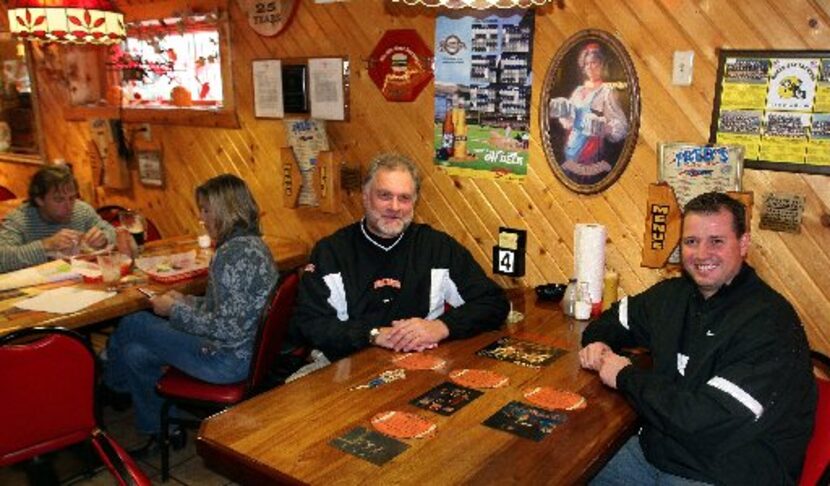 Steve Gerber (L) & Steve Berezowitz sit at the Tony Romo table at Fred's World Famous...