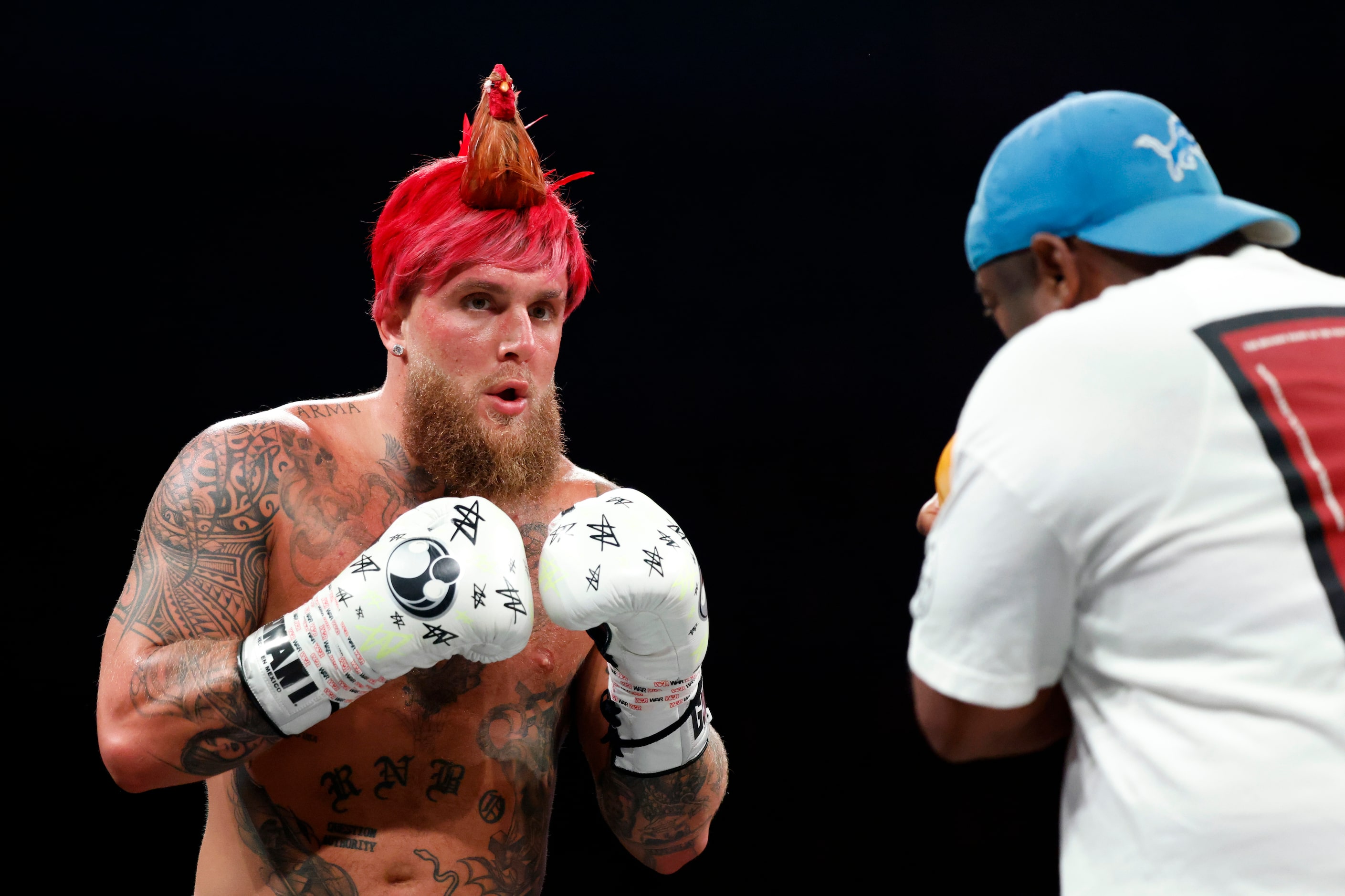 Jake Paul spars with a coach during an open workout ahead of his upcoming boxing bout...