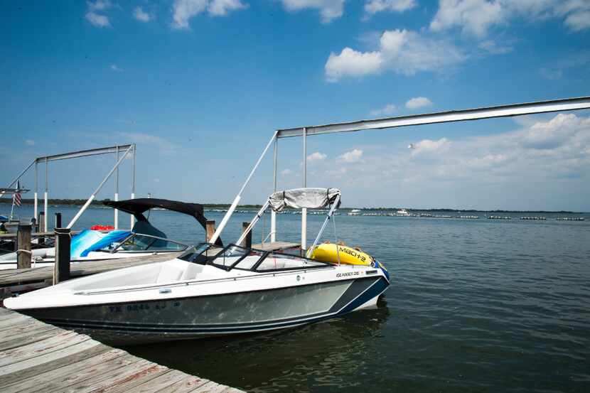 A boat is docked at the pier owned by Sneaky Pete's, a restaurant on Lewisville Lake. The...