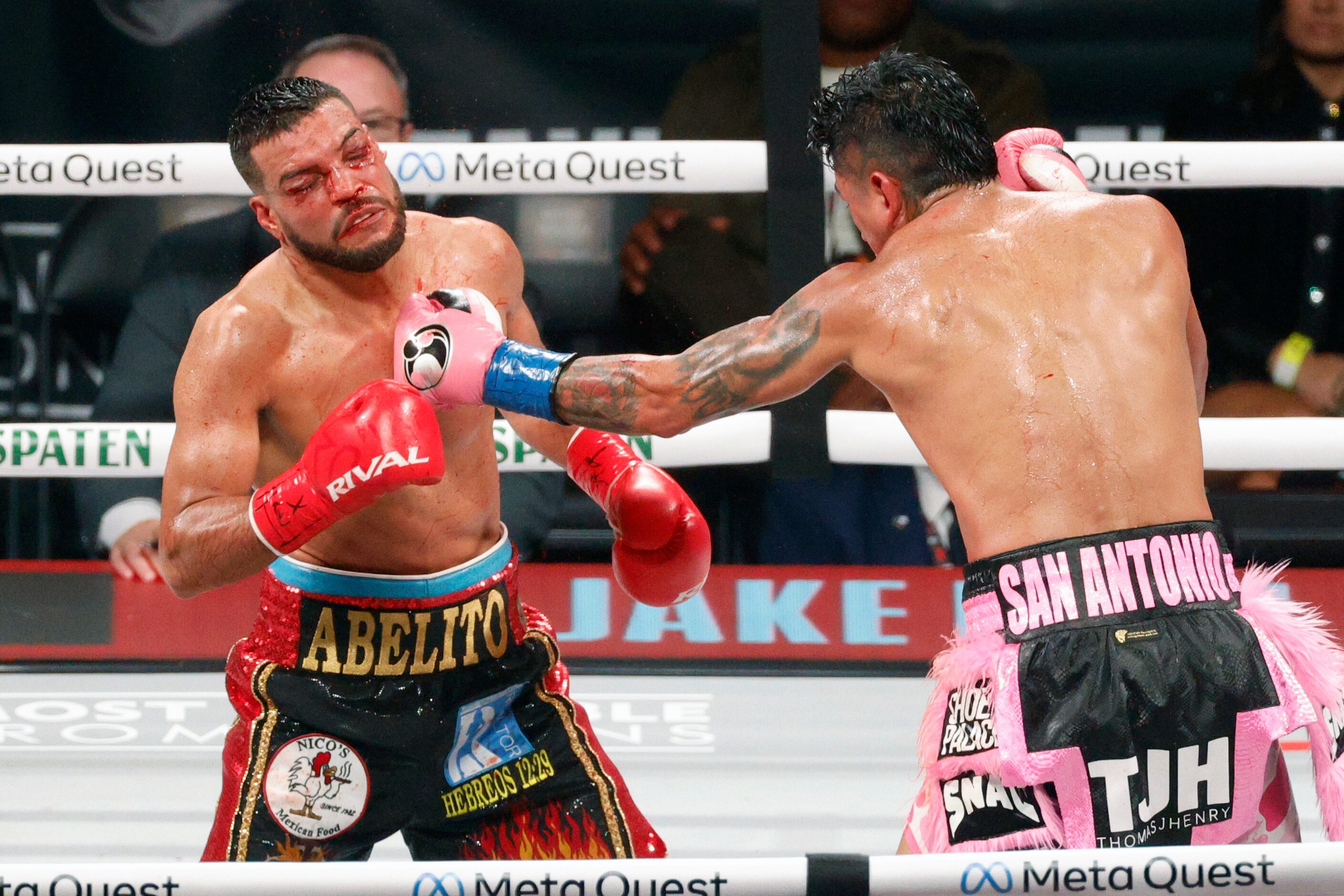 Abel Ramos takes a punch from Mario Barrios during round 12 of a boxing match for the WBC...