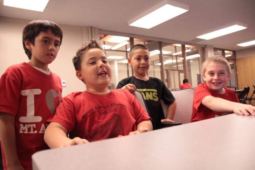 After school program students react to the game Cuboy Quest in the Samuell-Grand recreation...