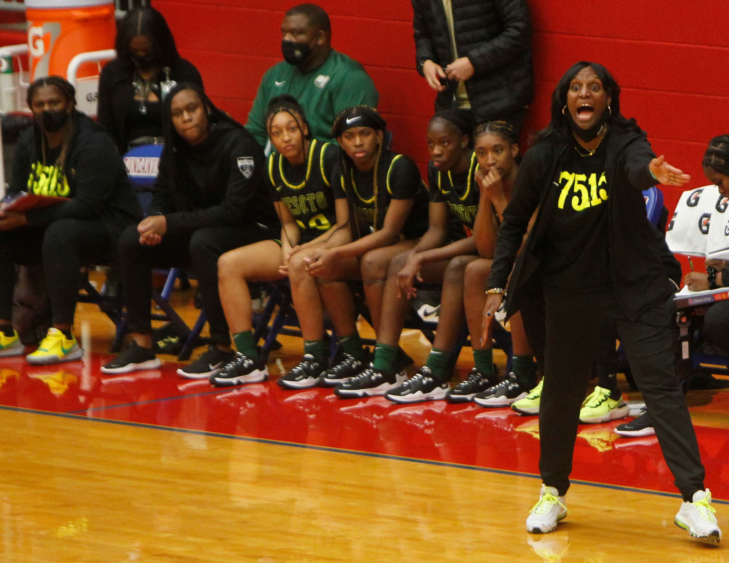 DeSoto head coach Andrea Robinson conveys a message to her players during first half action...