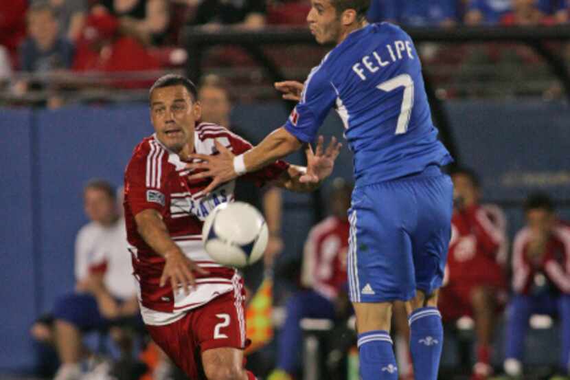 Daniel Hernandez #2 of FC Dallas and Felipe Martins #7 of the Montreal Impact go for a ball...