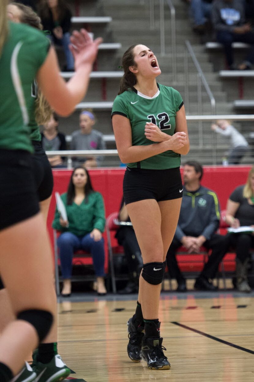 Southlake Carroll junior setter Lisie Kit celebrates a point against Allen during their...