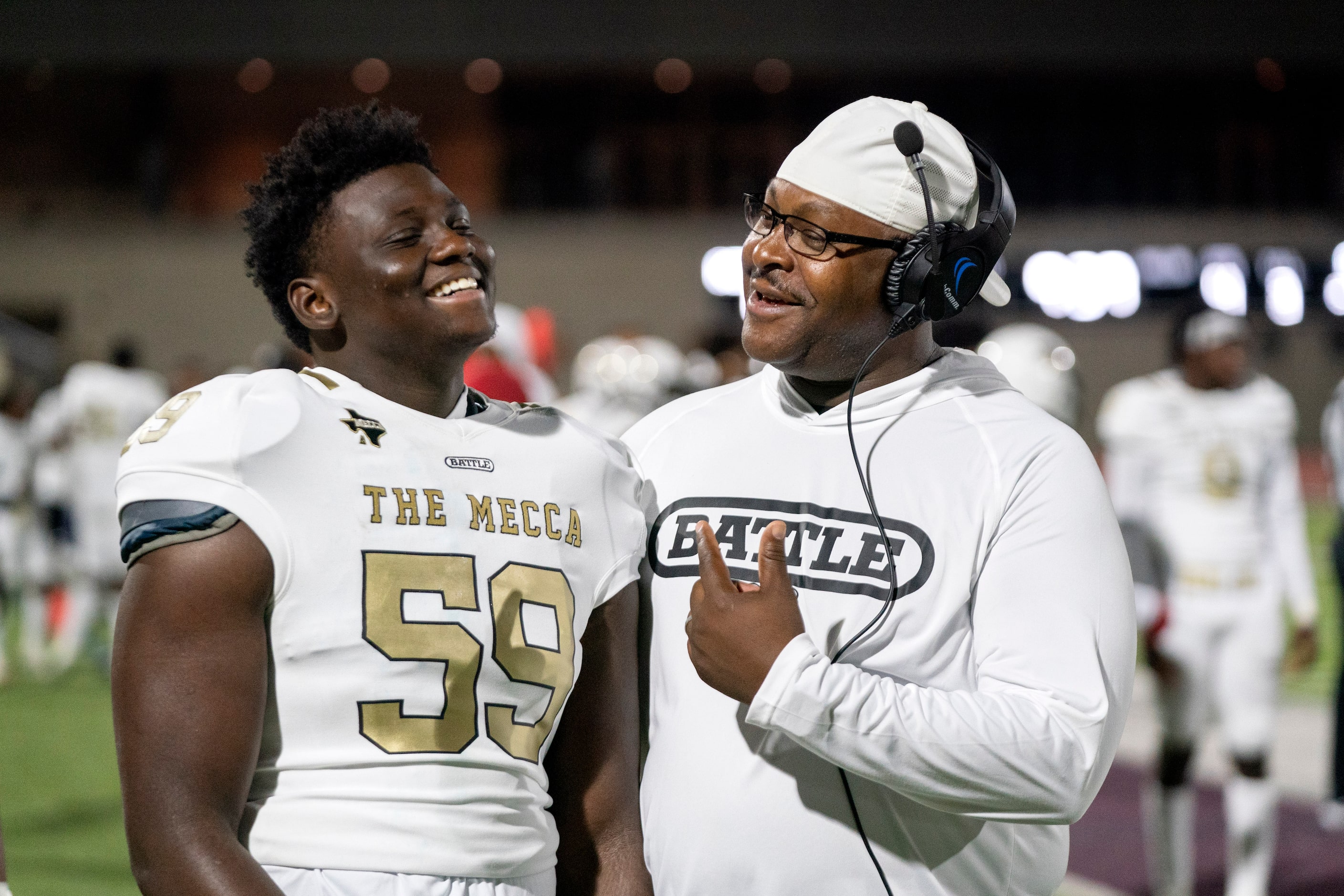 South Oak Cliff junior offensive lineman Kei Vohn Kendricks (59) jokes with coach Wayne...