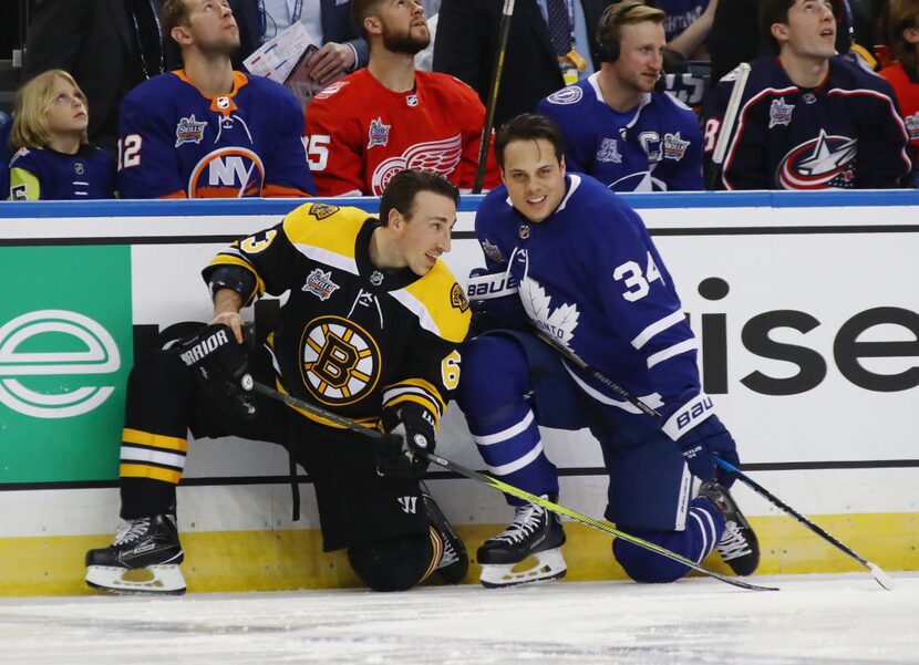 TAMPA, FL - JANUARY 27: Brad Marchand #63 of the Boston Bruins and Auston Matthews #34 of...