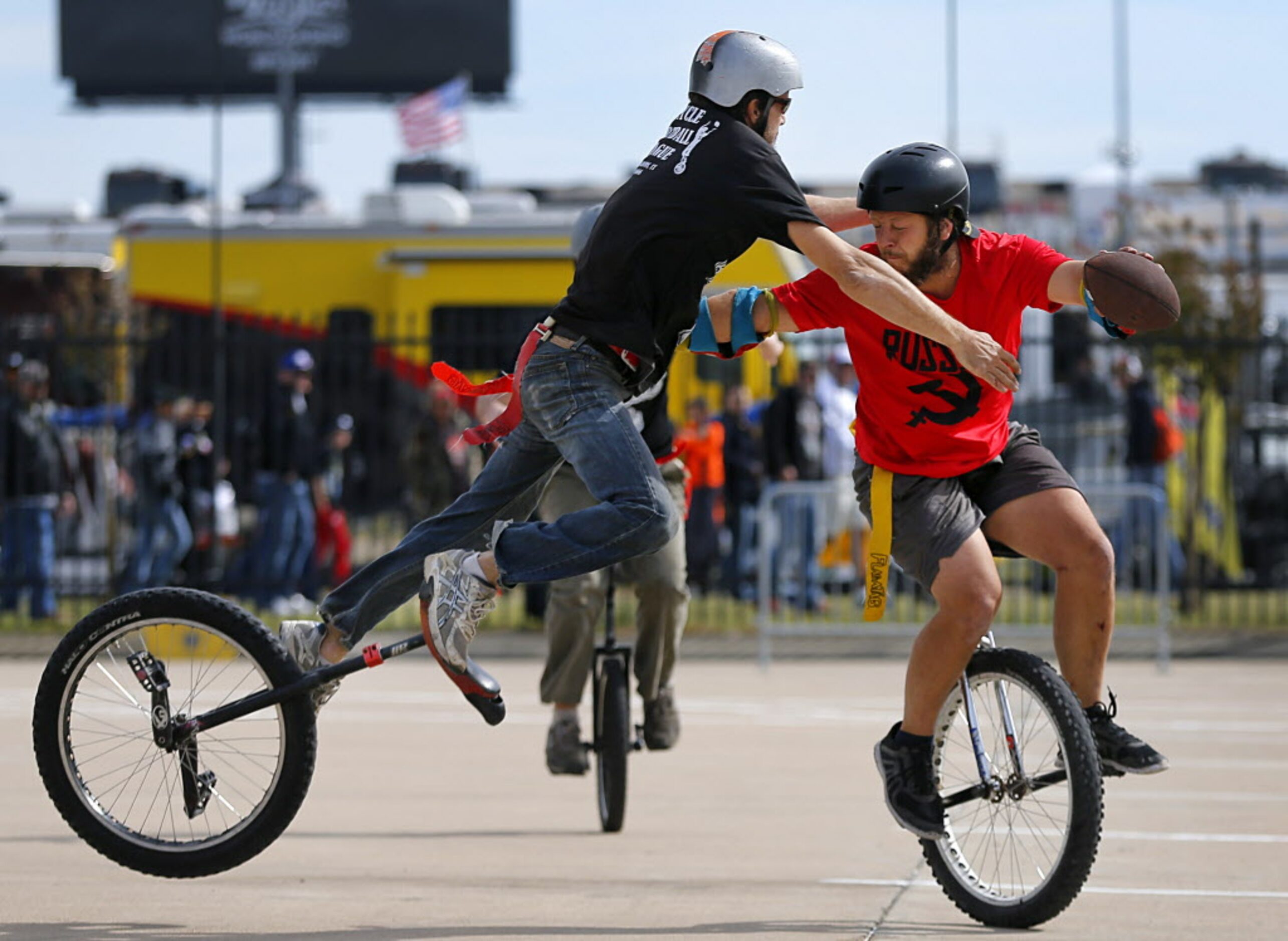 Uni Billies Chance 'Crazy Horse' Whited (left) makes a flying tackle onTeam Russia's Dan...