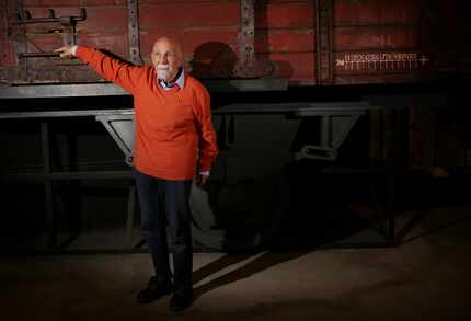 Holocaust survivor Simon Gronowski poses for photographs for the media by a replica railcar...