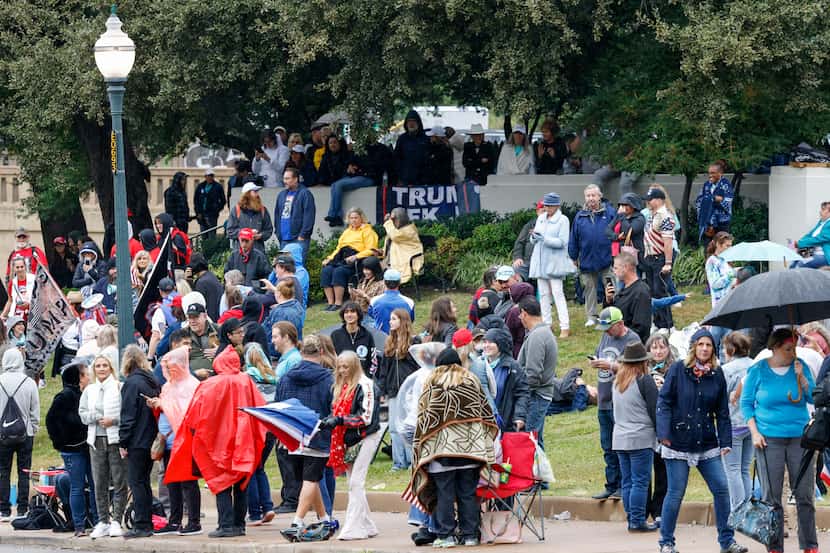 QAnon supporters gather along Elm Street at Dealey Plaza in downtown Dallas on Nov. 2, 2021....