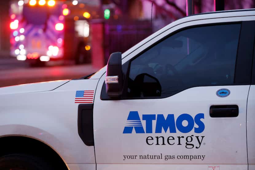 An Atmos Energy truck parked at the site where an explosion occurred at the Sandman...