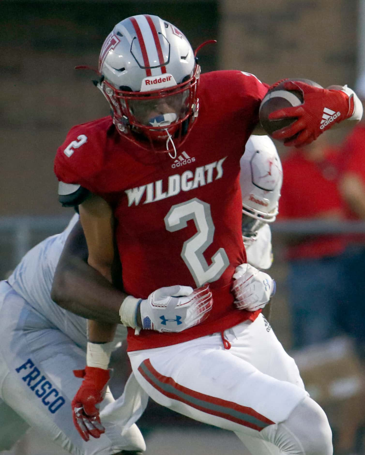 Dallas Woodrow Wilson tight end Evan Blackmon (2) adds yardage after the catch as he is...