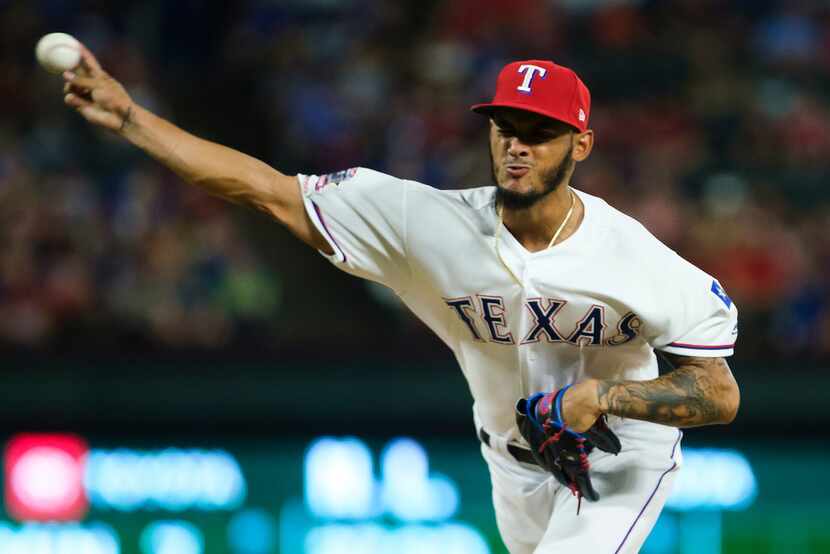 Texas Rangers relief pitcher Jonathan Hernandez  pitches during the seventh inning against...