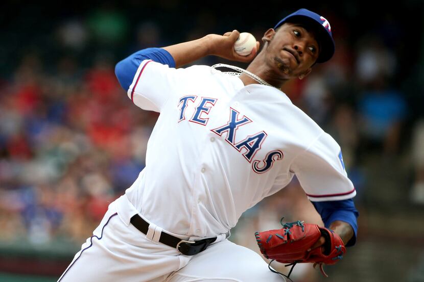 Texas Rangers relief pitcher Emmanuel Clase (43) pitches in his first major league game...