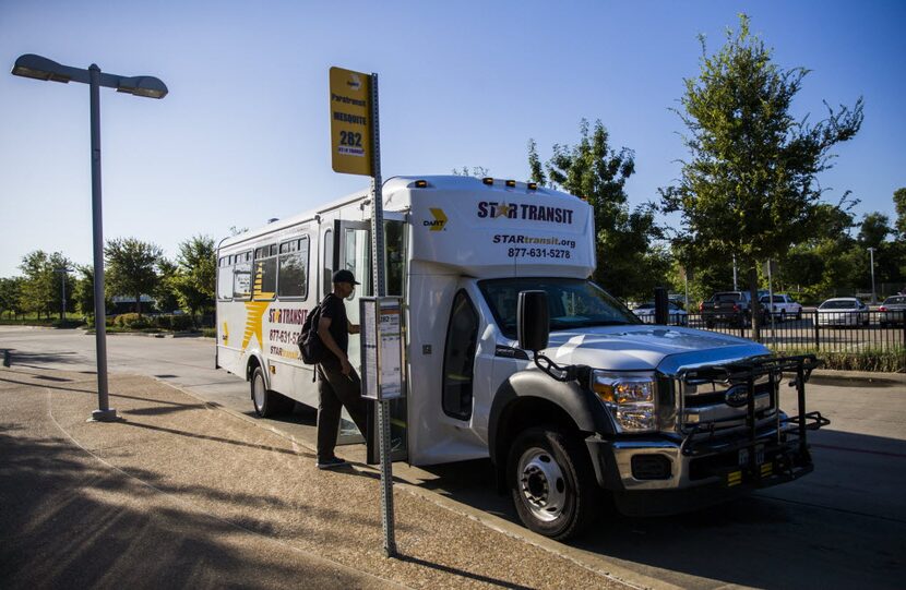 A man boards a STAR Transit bus at the DART Lawnview Station. (Ashley Landis/Staff...