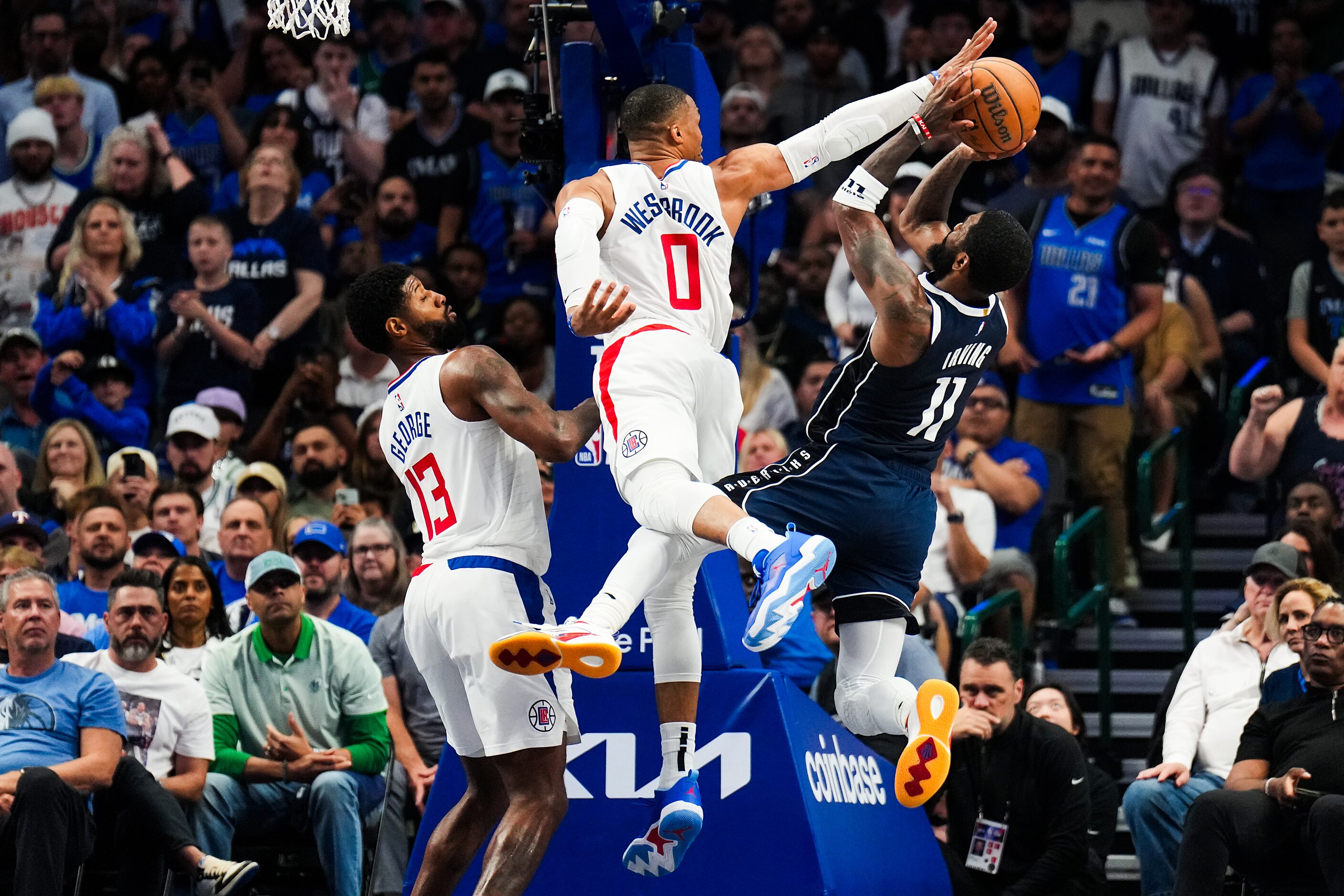 Dallas Mavericks guard Kyrie Irving (11) is fouled by LA Clippers guard Russell Westbrook...