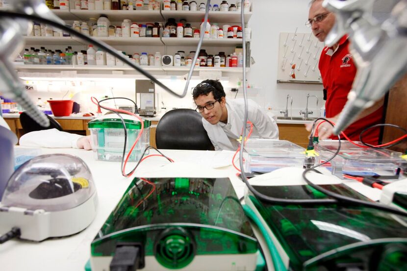 
Hillcrest High School junior Adam Burkhalter (left) and his science teacher Dr. Ward Coats...