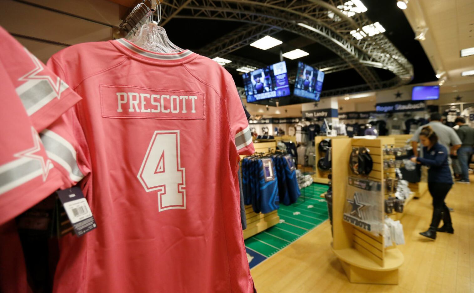 A Dallas Cowboys quarterback Dak Prescott jersey is on display for sale at the Dallas...