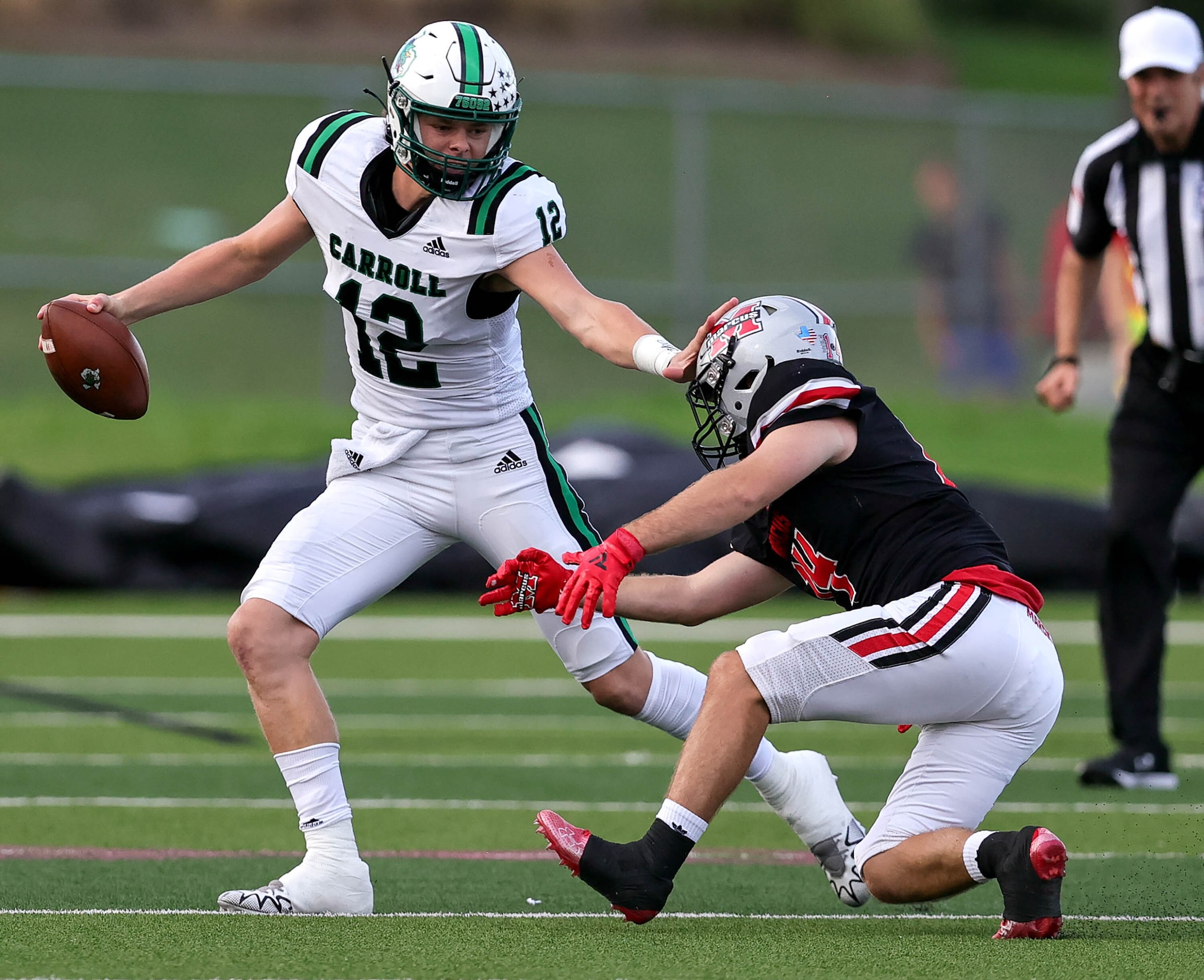 Southlake Carroll quarterback Kaden Anderson (12) tries to avoid Flower Mound Marcus...