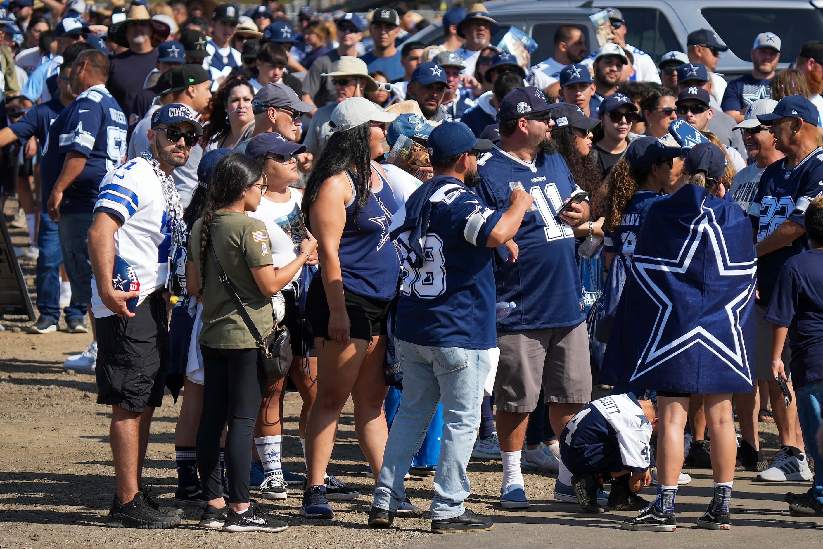 The line of fans to enter opening ceremonies for Dallas Cowboys training camp wraps around...