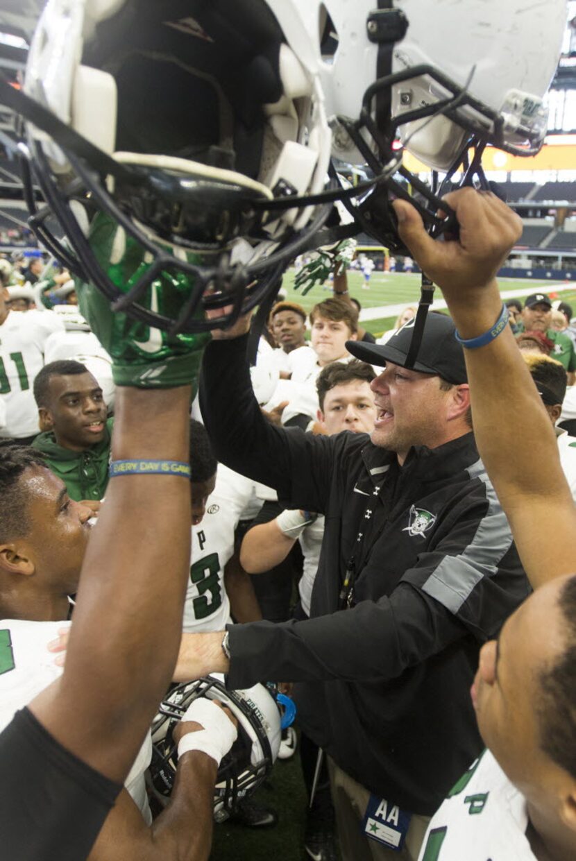 Poteet head coach Kody Groves celebrates with the Pirates after the 5A Division 1 Region 2...