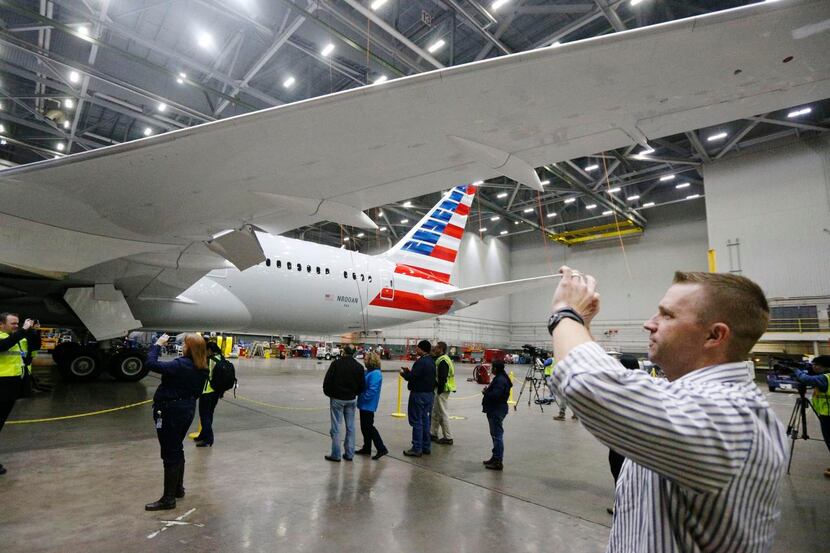 
Josh Morrissey of Hewlett-Packard takes photos of the American Airlines Dreamliner after...