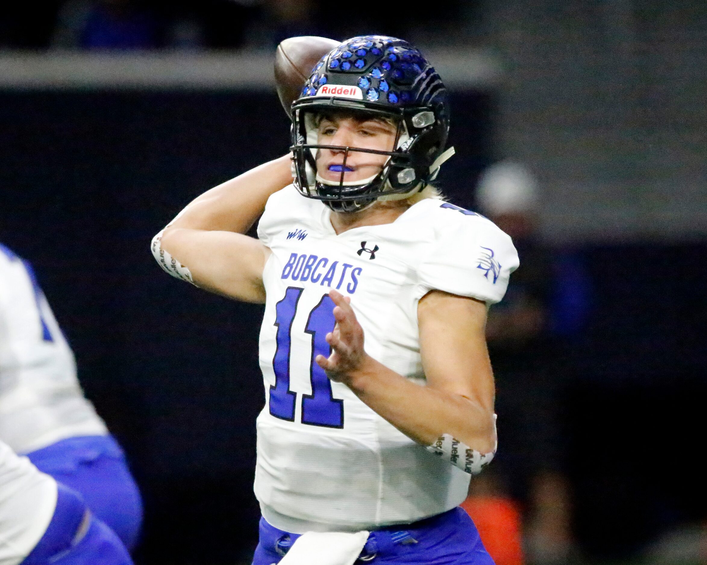 Guyer High School quarterback Jackson Arnold (11) throws a pass during the first half as...