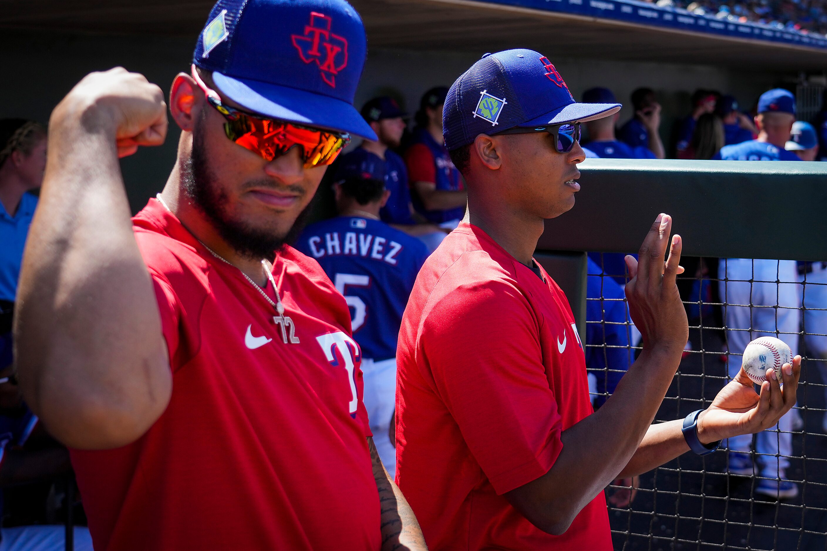 Texas Rangers pitcher Jonathan Hernández (left) and pitcher José Leclerc watch from the...