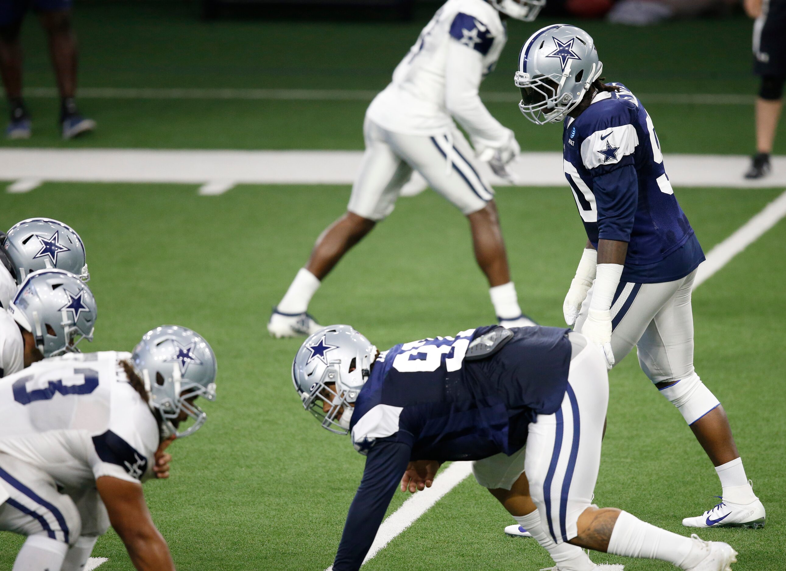 Dallas Cowboys defensive end DeMarcus Lawrence (90) at the line of scrimmage before the snap...