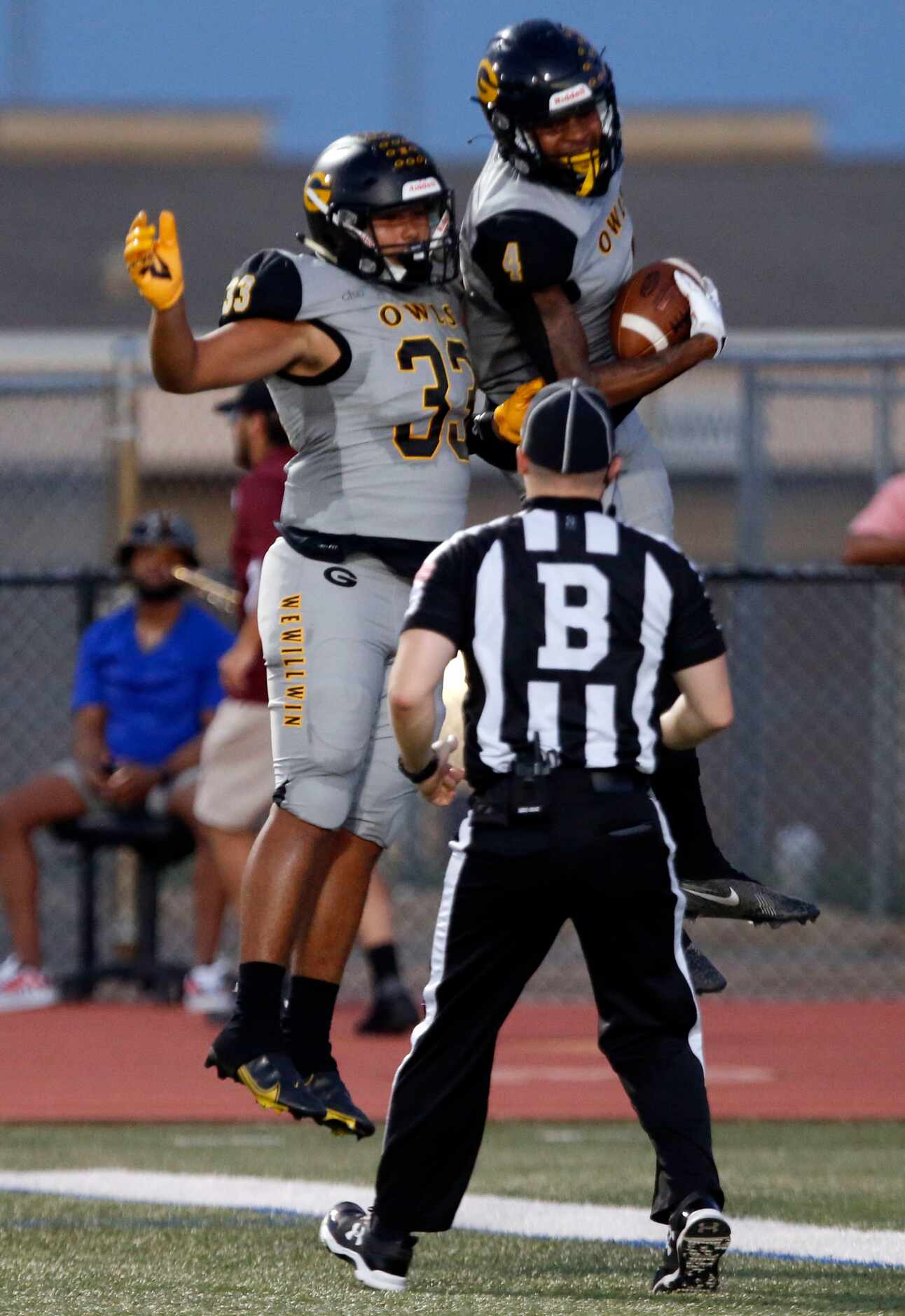 Garland high’s Kaleb Carcamo (33) and Charles Allen (4) celebrate Allen’s touchdown catch...