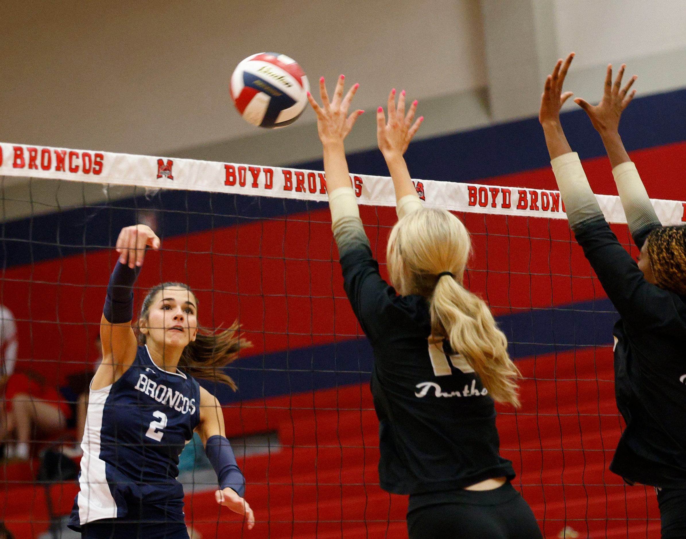 McKinney Boyd's Keira Bose (2) spikes the ball against Plano East's Grace Pinegar (13),...