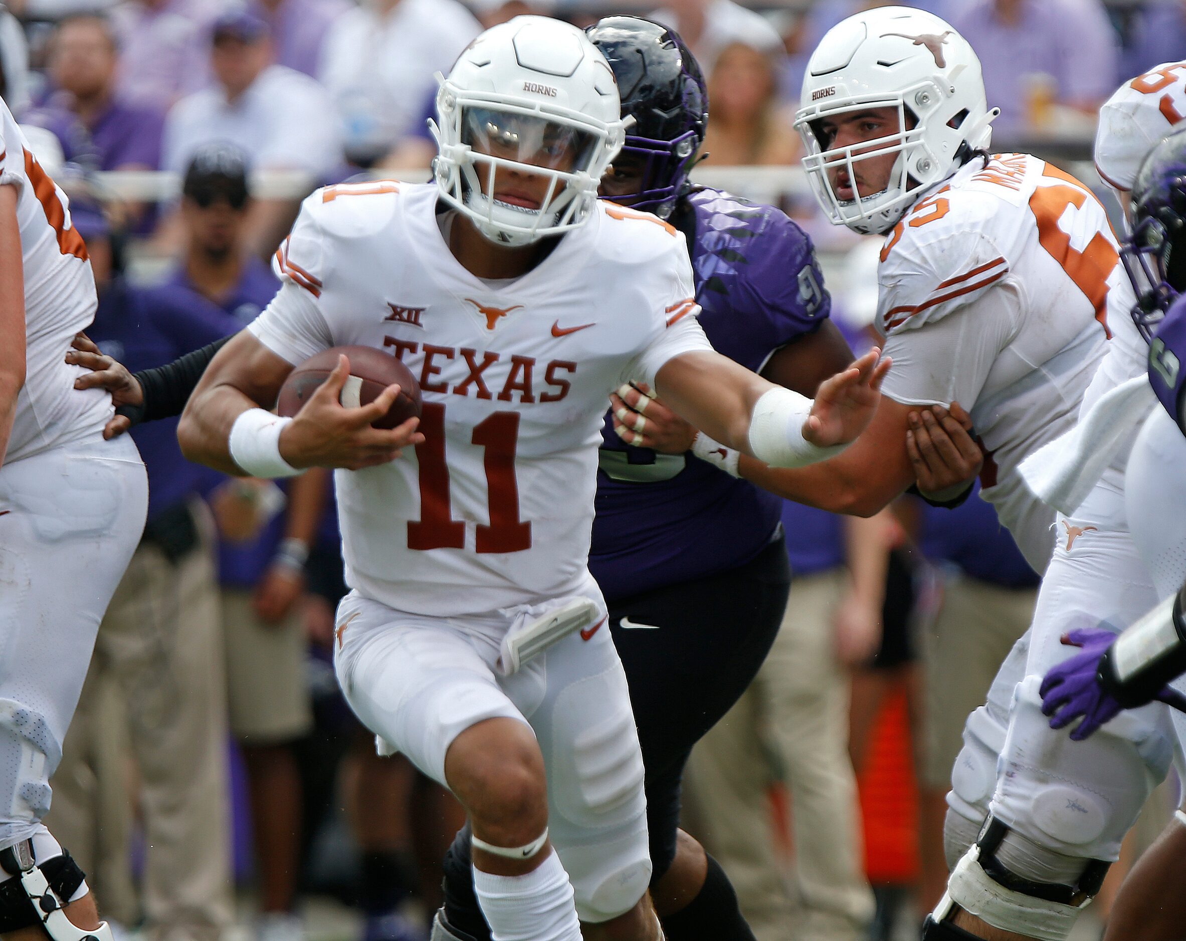 Texas Longhorns quarterback Casey Thompson (11) carries the football during the second half...