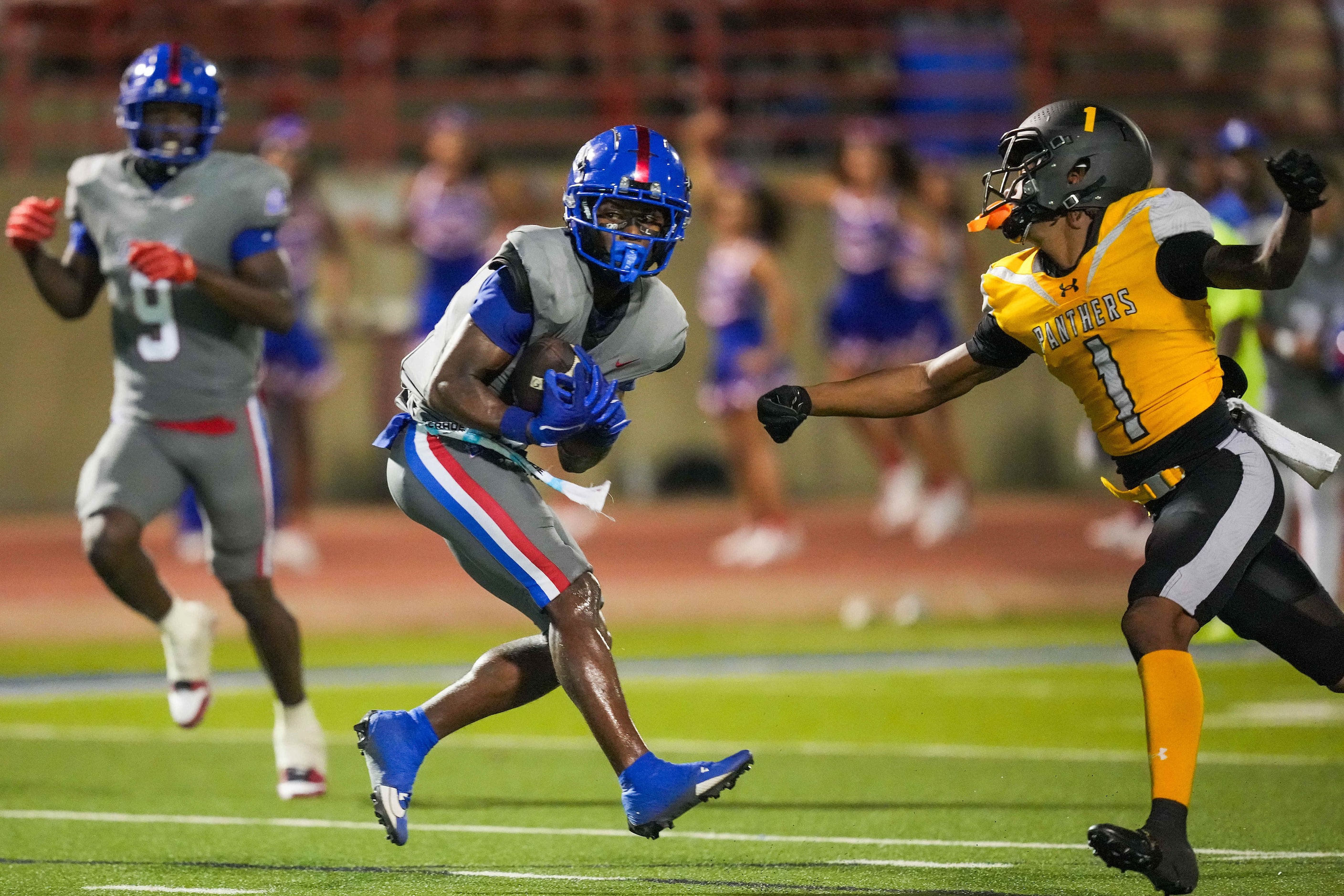 Duncanville wide receiver Ayson Theus (2) hauls in a 60-yard touchdown pass as St. Frances...