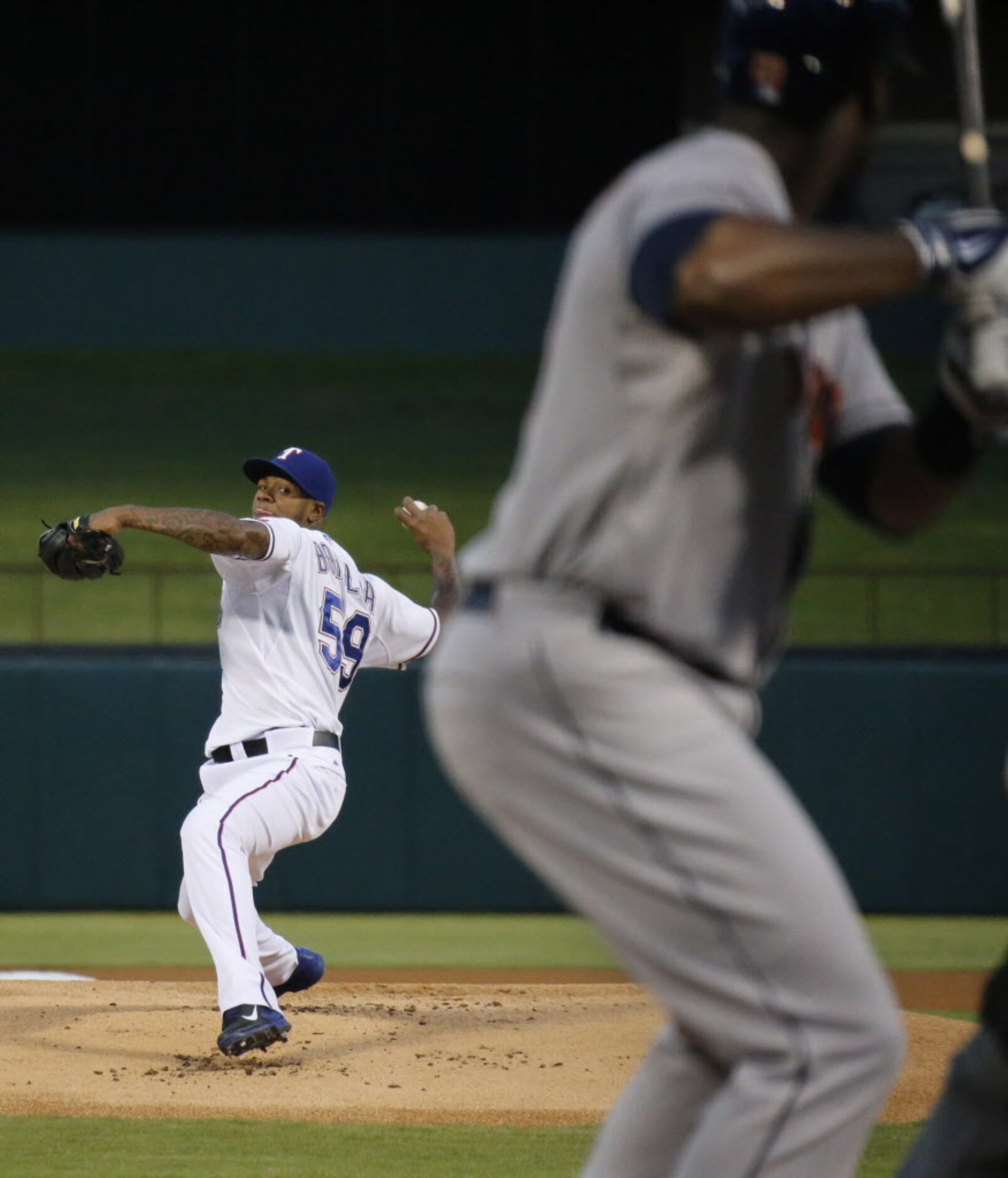 Texas starting pitcher Lisalverto Bonilla throws a first-inning pitch to Houston's Chris...