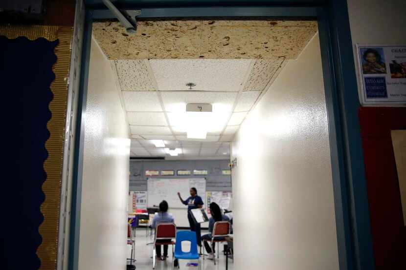 
Mismatched ceiling tiles are seen in the band room at Thomas A. Edison Middle Learning...