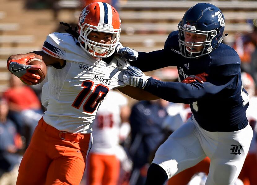UTEP wide receiver Warren Redix (10) is tackled by Rice linebacker Nick Uretsky (21) during...