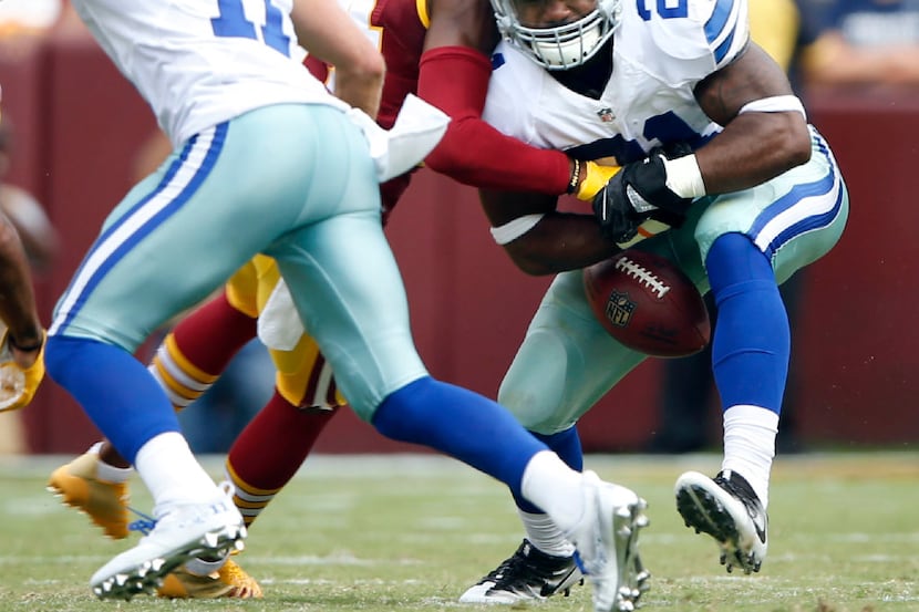 Washington Redskins cornerback Josh Norman (24) forces Dallas Cowboys running back Ezekiel...