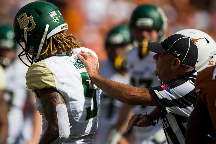FILE - Baylor wide receiver Jalen Hurd (5) is pushed away by a referee after he got in to an...
