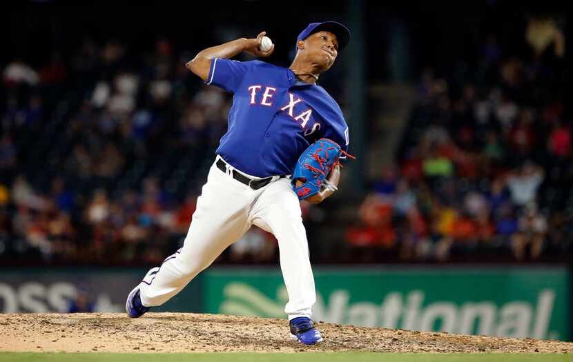 Texas Rangers relief pitcher Jose Leclerc (25) throws during the eighth inning against the...