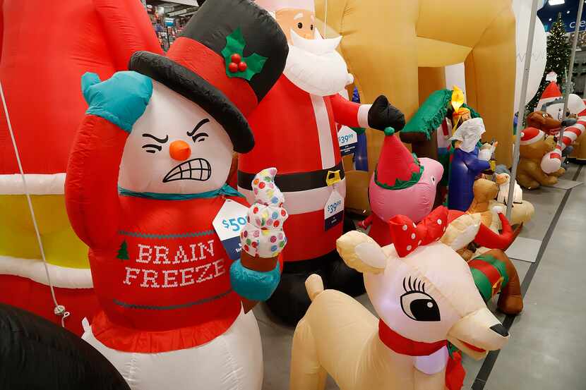 These Christmas yard inflatables at the At Home Store on Hwy. 121 in Plano are among the...