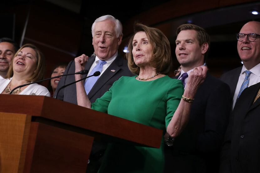 House Minority Leader Nancy Pelosi and other Democrats celebrate defeat of the GOP plan to...