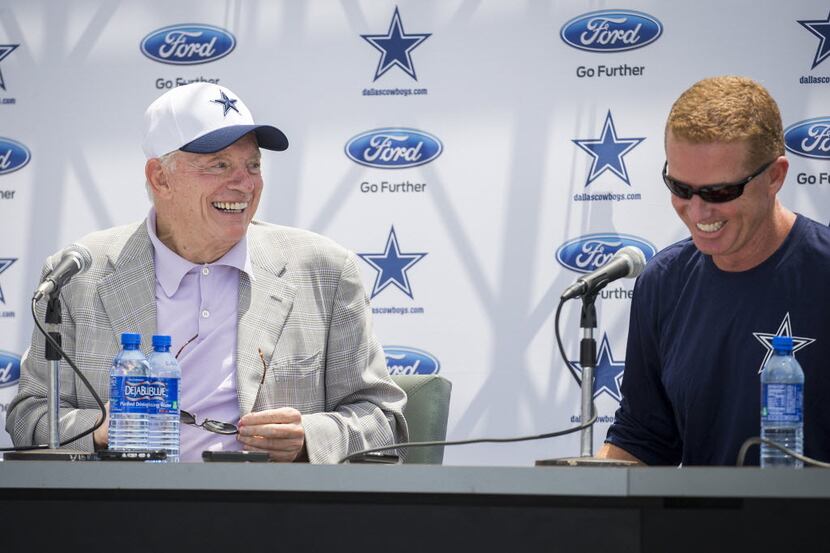 Dallas Cowboys owner Jerry Jones (left) laughs with head coach Jason Garrett during the...