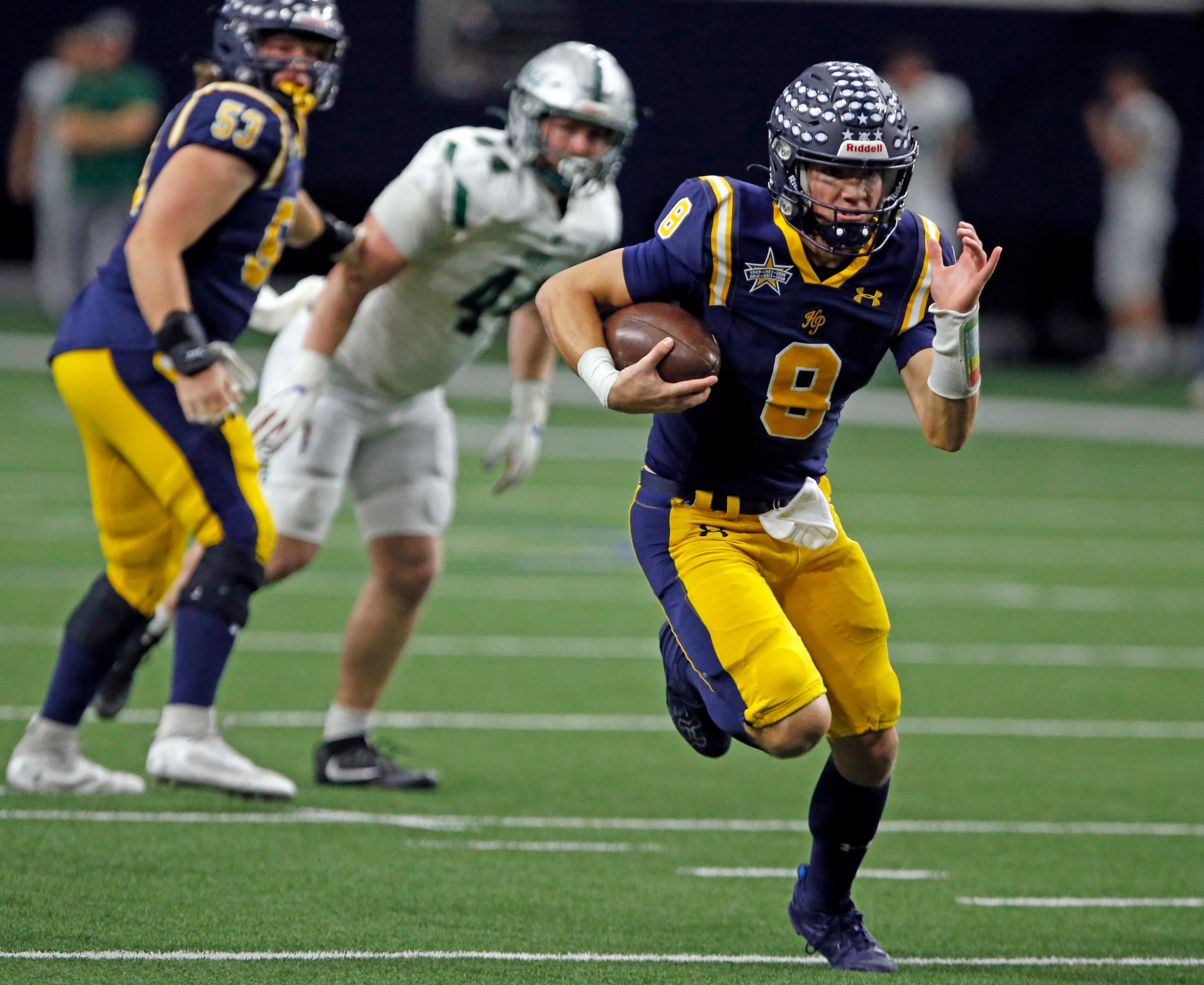 Highland Park High QB Buck Randall (8) runs for a first down during the first half of a high...