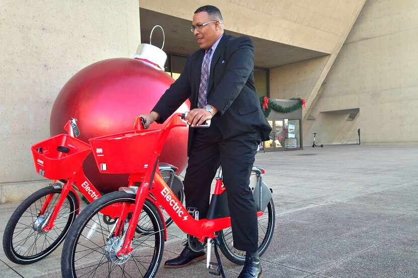 Dallas' transportation director Michael Rogers take a test spin on a JUMP bike